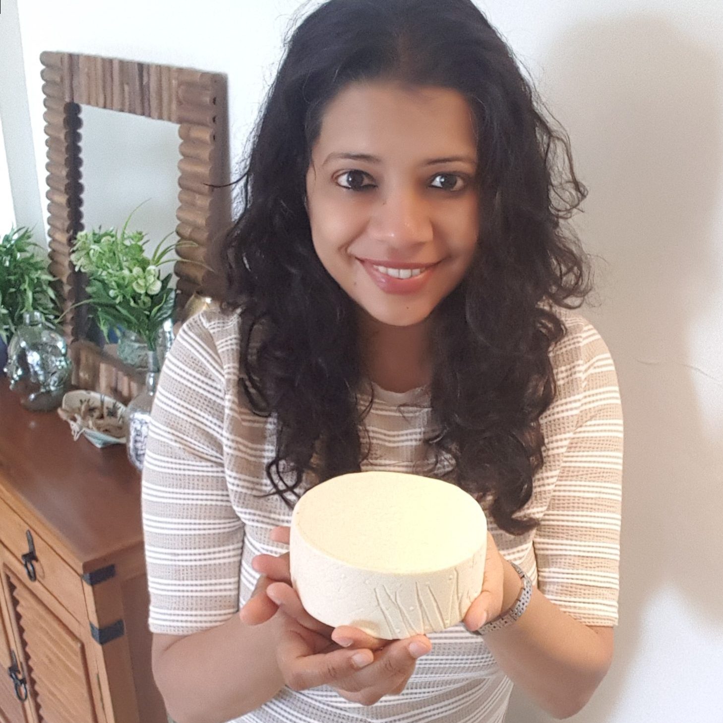 Dhvani holding wheel of Cheese in her hands and showing to camera!